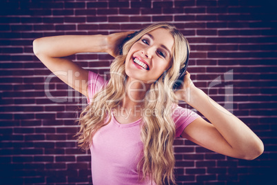 Portrait of a beautiful woman dancing with headphones