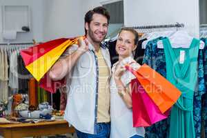 Smiling couple with shopping bags