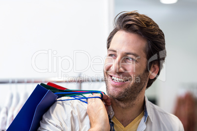 Smiling man with shopping bags