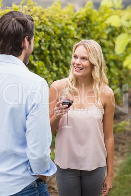 Young happy woman smiling at young man