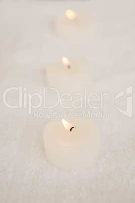 Close up of three lightened candles