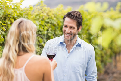 Young happy man smiling at woman