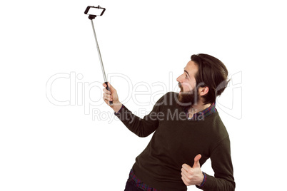 Hipster using his seflie stick