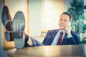 Relaxed businessman making a phone call