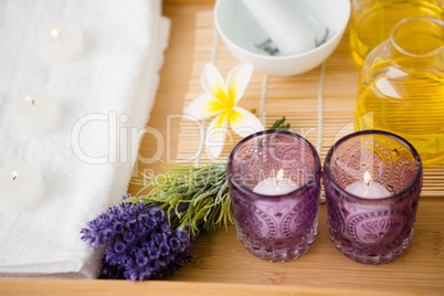 Massage tray with candles and oil