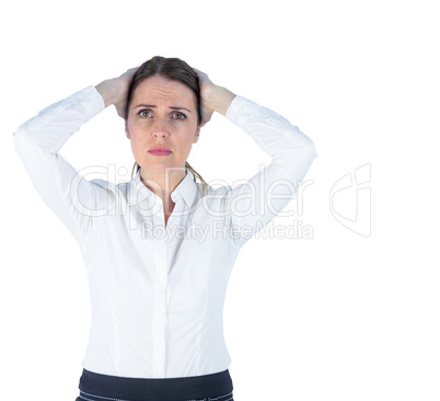 Stressed businesswoman with hands on her head