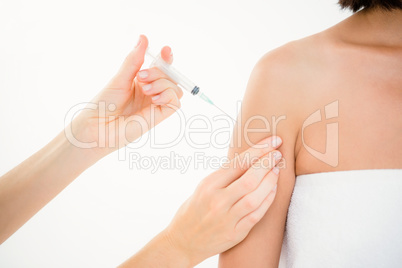 Woman receiving injection on arm