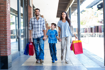 Portrait of a family with shopping bags