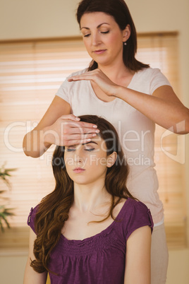 Young woman having a reiki treatment