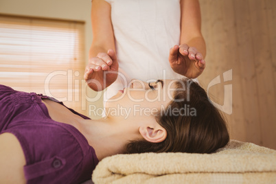 Young woman having a reiki treatment