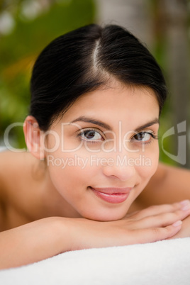 Pretty woman lying on the massage table