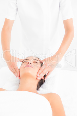 Attractive woman getting a head massage