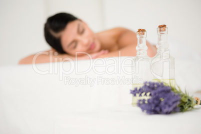 Focus on two massage oil bottles