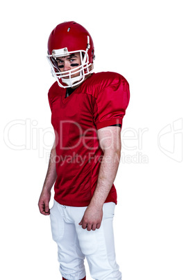 Serious american football player looking at camera