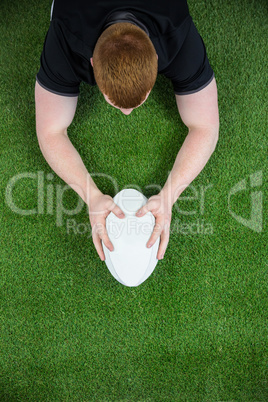 A rugby player scoring a try