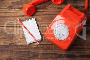 Telephone on table with notepad