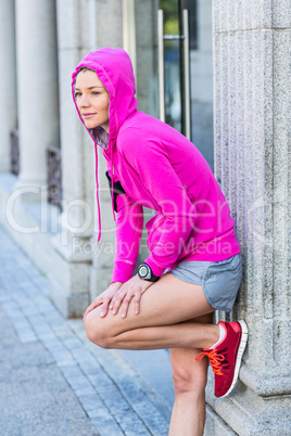 A woman wearing a pink jacket