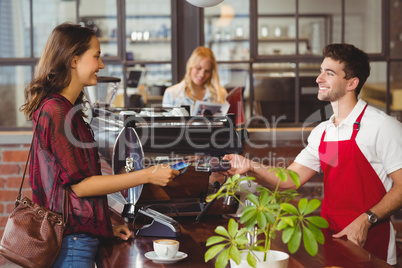 Customer handing a credit card to the waiter