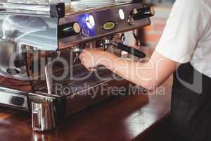 Barista preparing coffee machine