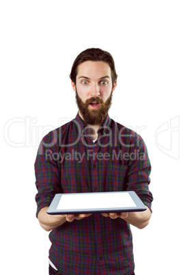 Handsome hipster showing tablet pc