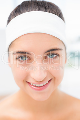 Hand applying eyeshadow to beautiful woman