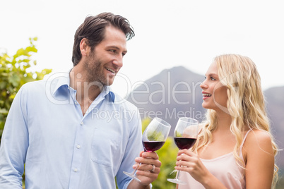 Young happy couple smiling at each other