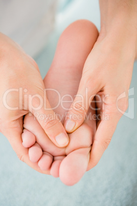 Close-up of a woman receiving foot massage