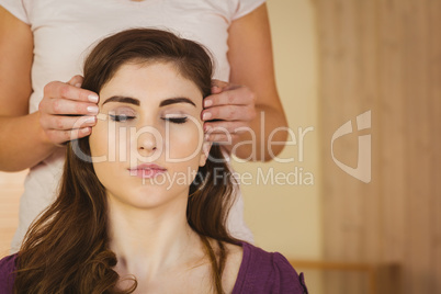 Young woman having a reiki treatment