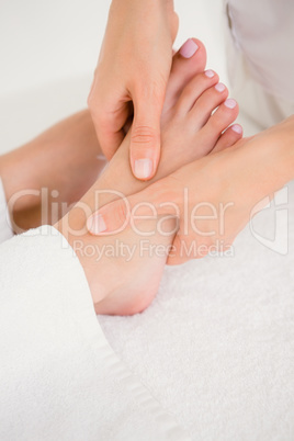 Close-up of a woman receiving foot massage