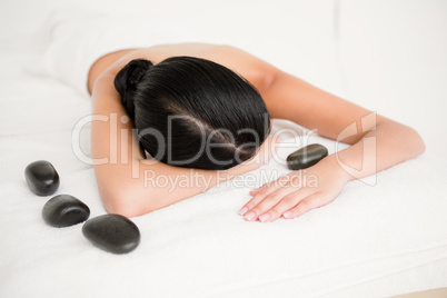 Woman having a massage with stones