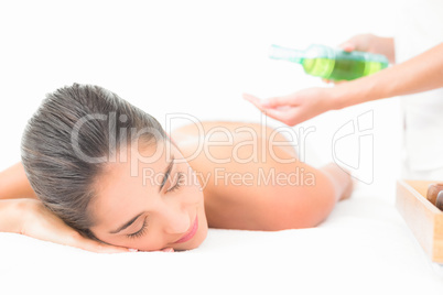 Beautiful brunette enjoying an oil massage