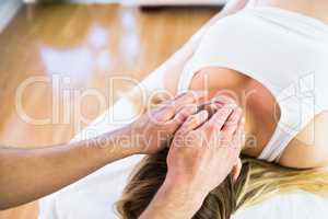 Relaxed pregnant woman enjoying reiki technique