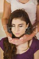 Young woman having a reiki treatment