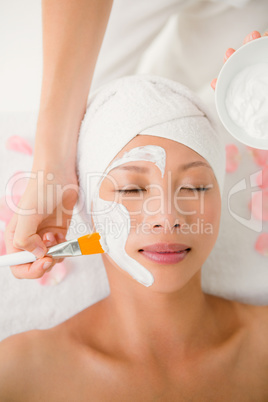 Attractive woman receiving treatment at spa center