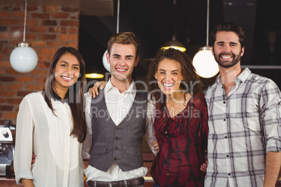 Smiling friends with arms around