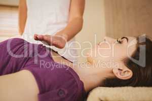 Young woman having a reiki treatment