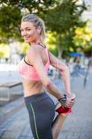 A beautiful woman stretching her leg