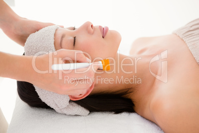 Attractive woman receiving massage at spa center