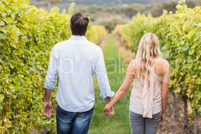 Young happy couple holding hands