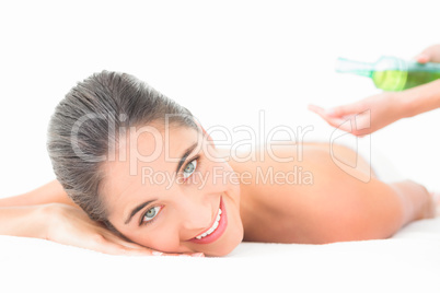 Beautiful brunette enjoying an oil massage