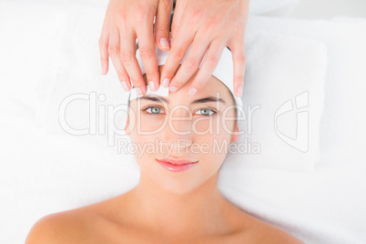 Hand waxing beautiful womans eyebrow