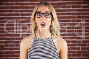 Gorgeous blonde hipster being shocked