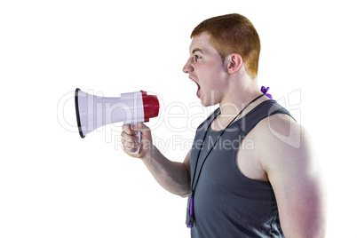 Angry personal trainer yelling through megaphone