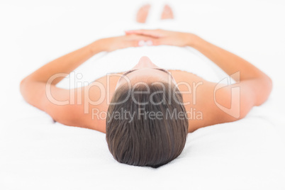 Beautiful young pretty woman on massage table