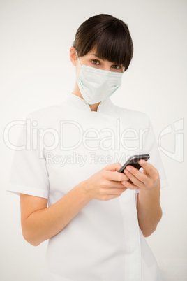 Portrait of a nurse using her mobile phone