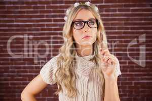 Gorgeous thoughtful blonde hipster holding pen