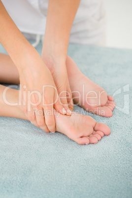 Close-up of a woman receiving foot massage