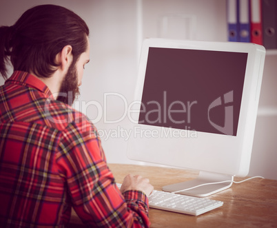 Hipster businessman working on his computer