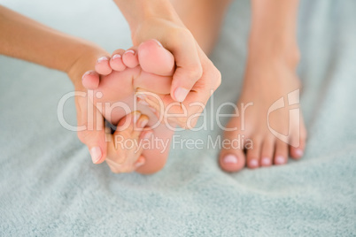Close-up of a woman receiving foot massage