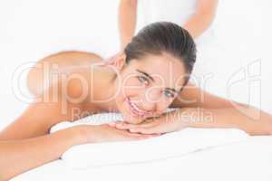 Attractive woman receiving back massage at spa center